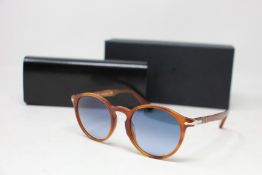 A pair of as new Persol sunglasses.