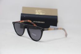 A pair of as new Burberry sunglasses.