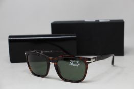 A pair of as new Persol sunglasses.