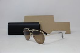 A pair of as new Burberry sunglasses.