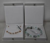 An as new Coeur De Lion Geo Cube Light Green Bracelet 4017/30-0520 (RRP £75) and an as new Coeur