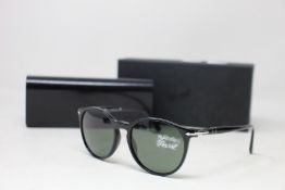 A pair of as new Persol sunglasses.