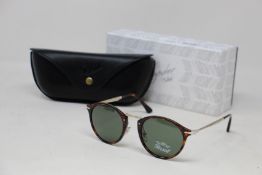 A pair of as new Persol Calligraphy Edition sunglasses.