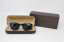 A pair of as new Persol sunglasses.