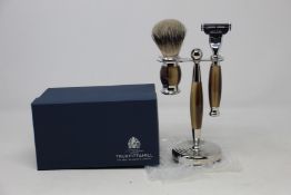 A boxed as new Truefitt & Hill Faux Horn Edwardian Shaving Set; Badger Brush, Mach III Razor and