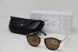 A pair of as new Persol Calligraphy Edition sunglasses.