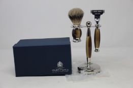 A boxed as new Truefitt & Hill Faux Horn Edwardian Shaving Set; Badger Brush, Mach III Razor and
