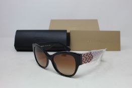 A pair of as new Burberry sunglasses.