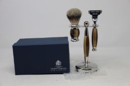A boxed as new Truefitt & Hill Faux Horn Edwardian Shaving Set; Badger Brush, Mach III Razor and