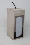 A SONOS Roam portable smart speaker in white.