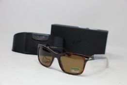 A pair of as new Persol sunglasses.