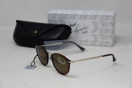 A pair of as new Persol Calligraphy Edition sunglasses.