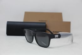 A pair of as new Burberry sunglasses.