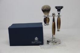 A boxed as new Truefitt & Hill Faux Horn Edwardian Shaving Set; Badger Brush, Mach III Razor and
