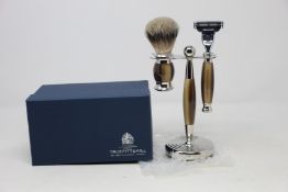 A boxed as new Truefitt & Hill Faux Horn Edwardian Shaving Set; Badger Brush, Mach III Razor and
