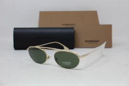 A pair of as new Burberry sunglasses.