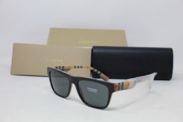 A pair of as new Burberry sunglasses.