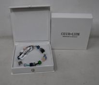 Two as new Coeur De Lion Blue Green Grey Mixed Geo Cube Bracelet 4905/30-0705 (RRP £95).