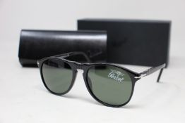 A pair of as new Persol sunglasses.