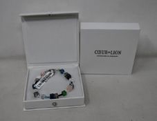 Two as new Coeur De Lion Blue Green Grey Mixed Geo Cube Bracelet 4905/30-0705 (RRP £95).