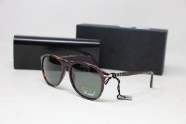 A pair of as new Persol sunglasses.
