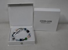 Two as new Coeur De Lion Blue Green Grey Mixed Geo Cube Bracelet 4905/30-0705 (RRP £95).