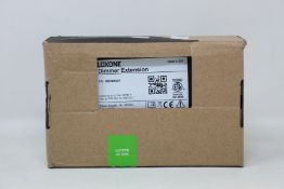 A boxed as new Loxone Dimmer Extension (Item no. 100029).