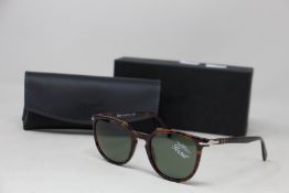 A pair of as new Persol sunglasses.