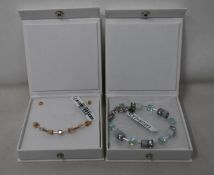 An as new Coeur De Lion Geo Cube Light Green Bracelet 4017/30-0520 (RRP £75) and an as new Coeur