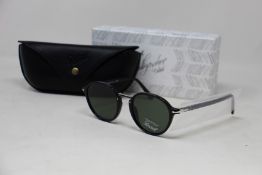 A pair of as new Persol Calligraphy Edition sunglasses.