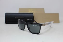 A pair of as new Burberry sunglasses.