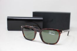 A pair of as new Persol sunglasses.