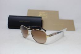 A pair of as new Burberry sunglasses.