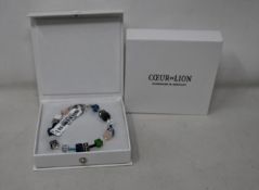 Two as new Coeur De Lion Blue Green Grey Mixed Geo Cube Bracelet 4905/30-0705 (RRP £95).