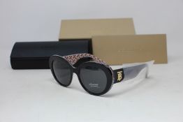 A pair of as new Burberry sunglasses.