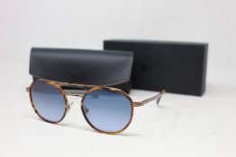 A pair of as new Persol sunglasses.