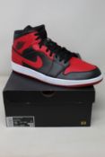 A pair of as new Nike Air Jordan 1 Mid (UK 14).