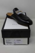A pair of as new Gucci leather horsebit slippers (EU 38 - RRP £580).