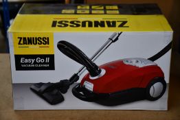 A new Zanussi Easy Go ll Red 3L, 700W, 7.5M radius retractable cord vacuum cleaner.