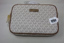 An as new Michael Kors Vanilla Jet Set bag.