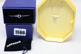 An as new Swarovski simple bracelet (5524421), chain with pendant (5599177) and a necklace