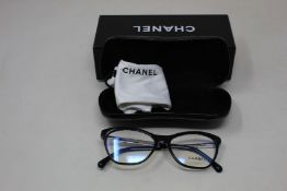 A pair of as new Chanel glasses frames.