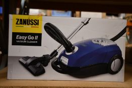 A new Zanussi Easy Go ll Blue 3L, 700W, 7.5M radius retractable cord vacuum cleaner.