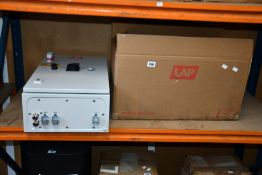 A LAP Cad Pro Distribution Box with cables and remotes (No projector, slightly damaged).