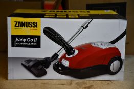 A new Zanussi Easy Go ll Red 3L, 700W, 7.5M radius retractable cord vacuum cleaner.