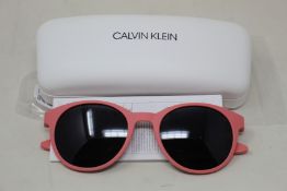 A pair of as new Calvin Klein sunglasses.