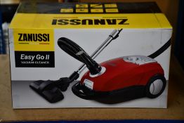 A new Zanussi Easy Go ll Red 3L, 700W, 7.5M radius retractable cord vacuum cleaner.