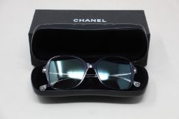 A pair of as new Chanel glasses frames.