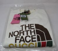 An as new The North Face Gucci sweater with authentication tag (XL).