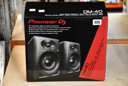 A pair of boxed as new Pioneer DM-40 active monitor speakers.